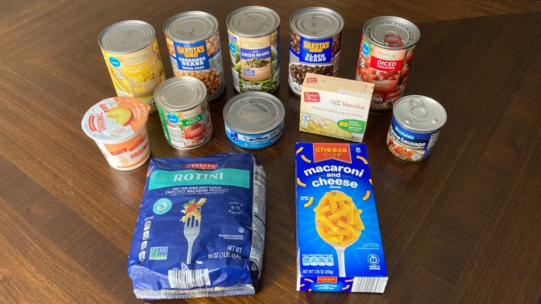 Assorted canned and packaged foods from Aldi on a table