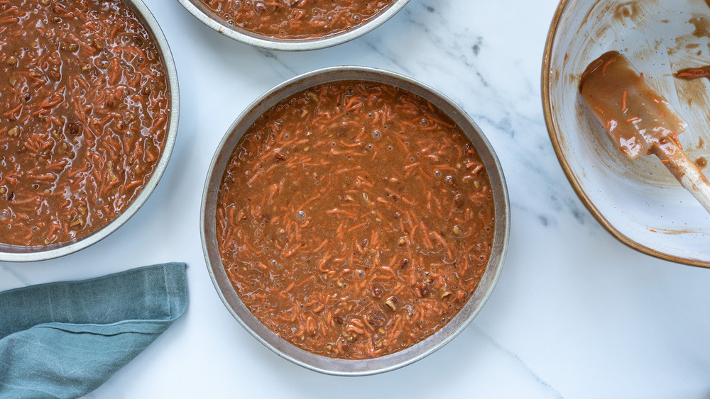 Carrot cake batter in baking pans