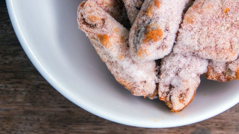 Frozen chicken wings sitting on a white plate