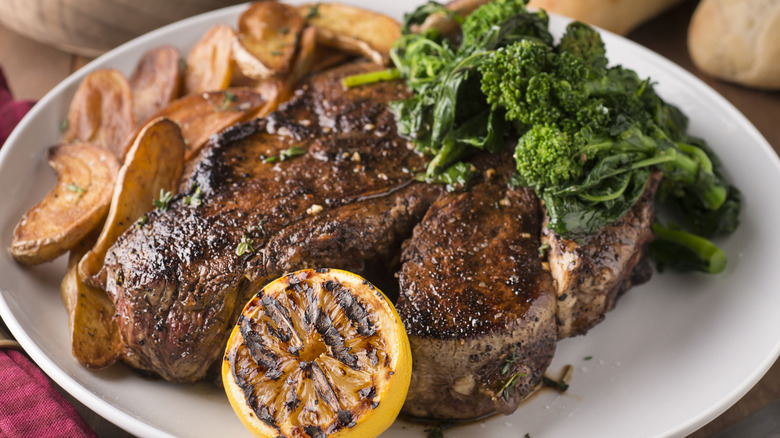 Sliced porterhouse steak with sauces