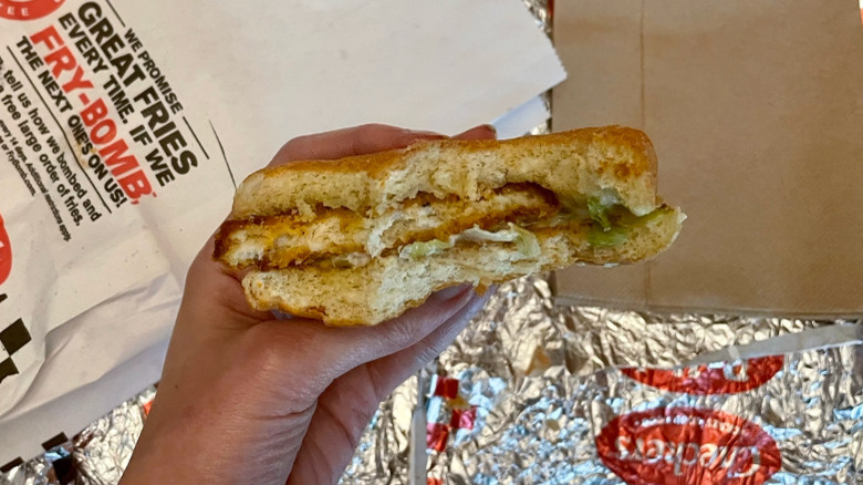 spicy chicken sandwich in hand