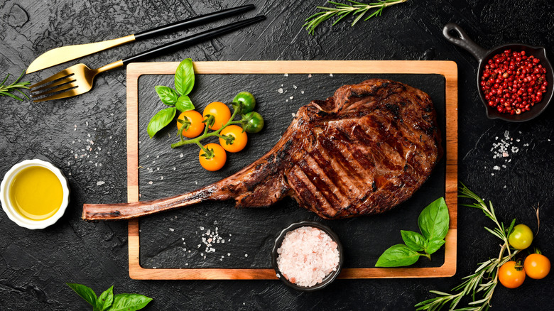 Tomahawk steak on wooden board