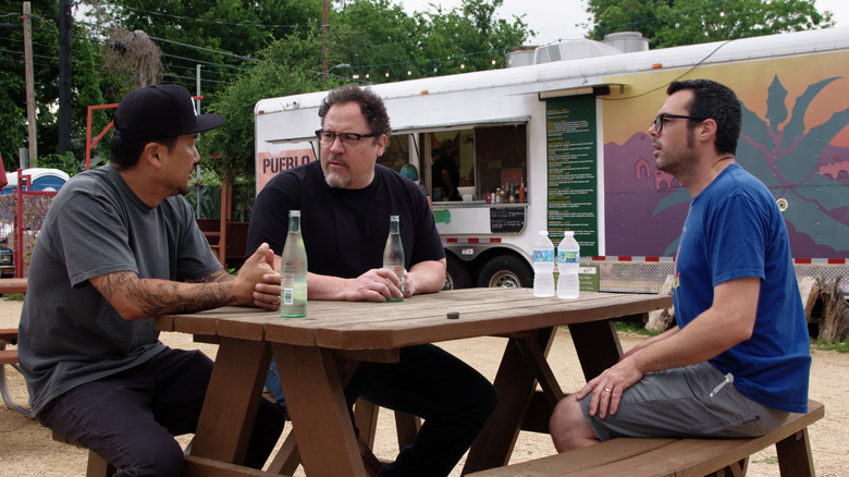 Jon Favreau and Roy Choi talking with a friend