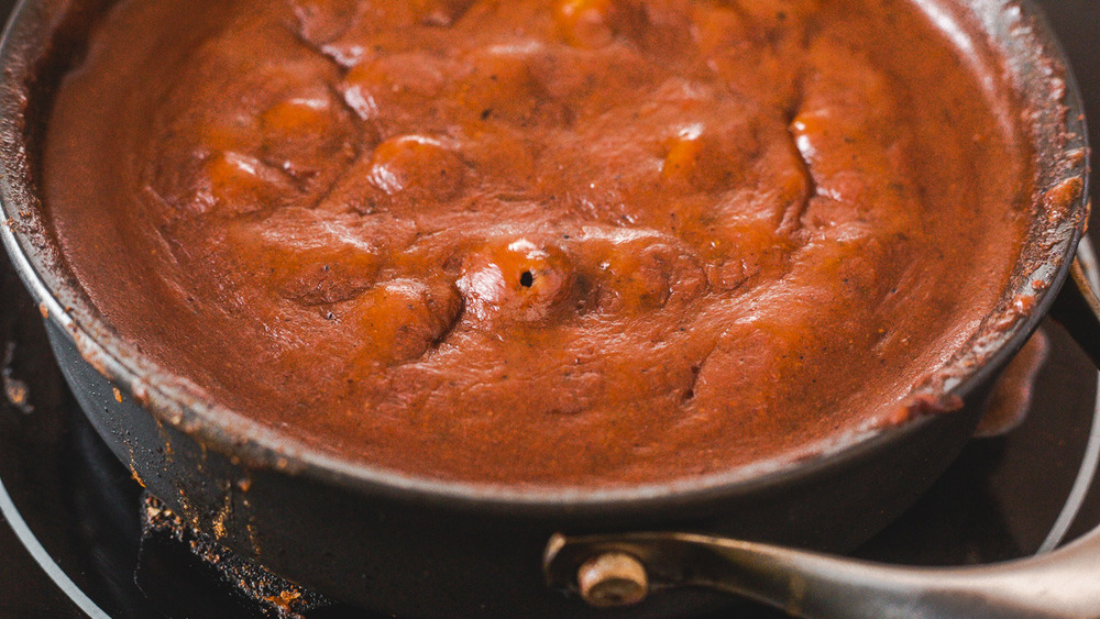 chicken enchiladas recipe sauce bubbling in pan