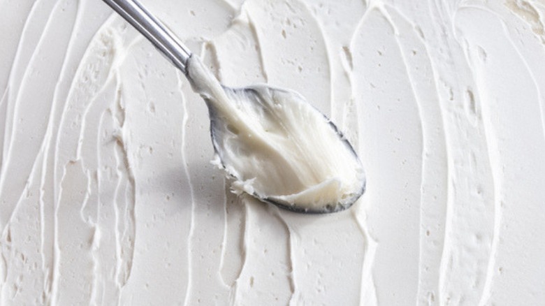 white frosting with spoon