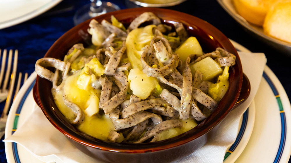 Pizzoccheri in a brown bowl on a table