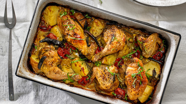 A sheet pan with roasted chicken and potatoes