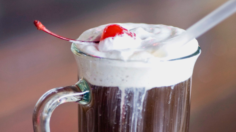 Spiked Hot chocolate with a cherry and straw