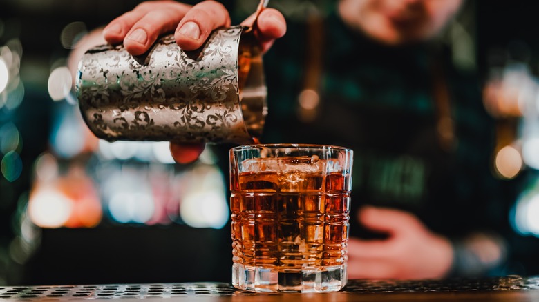 Bartender mixing a classic cocktail