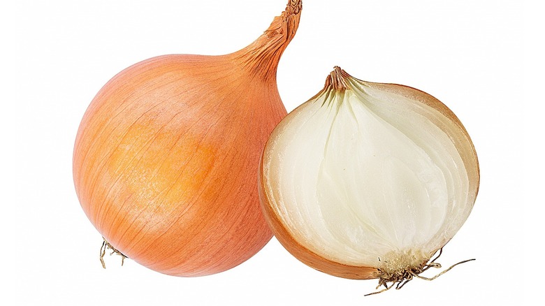 raw yellow onion cut in half