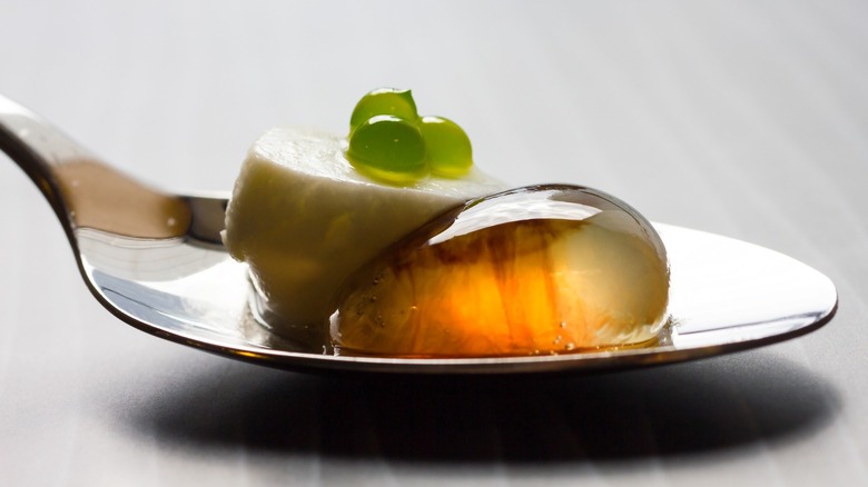 A bite-sized amuse-bouche served on a spoon