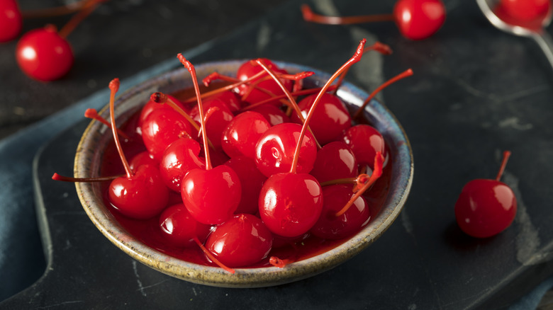 Red maraschino cherries in bowl