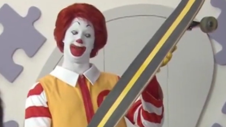 David Hussey as Ronald McDonald holding a skateboard 