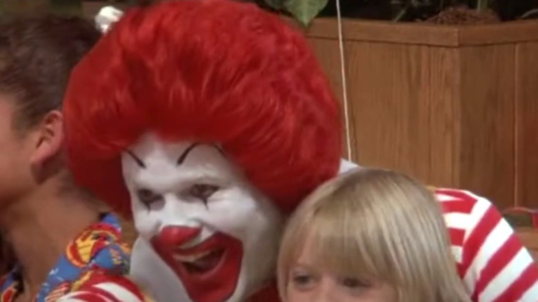 Squire Fridell as Ronald McDonald with young child