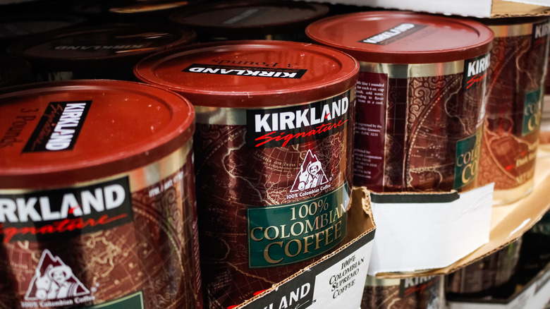 Cans of Kirkland coffee on shelf