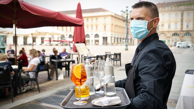 Waiter carrying food