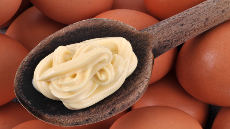 mayonnaise on spoon and eggs