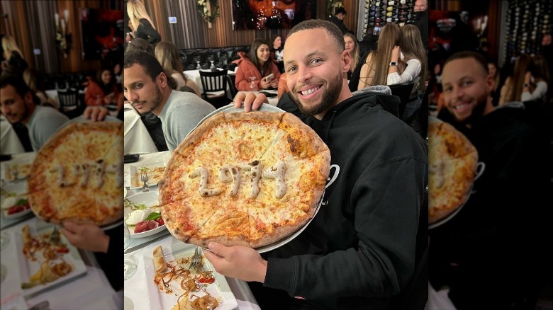 Steph Curry with a pizza of his own