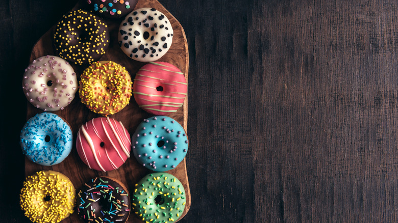 Colorful donuts on tray