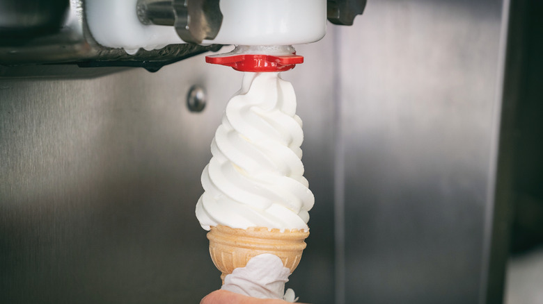 Soft serve machine dispensing ice cream into cone