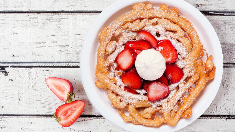 funnel cake with cream and strawberries