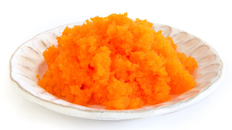 a plate of bright orange tobiko