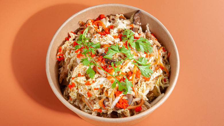 Japanese noodle salad on orange background