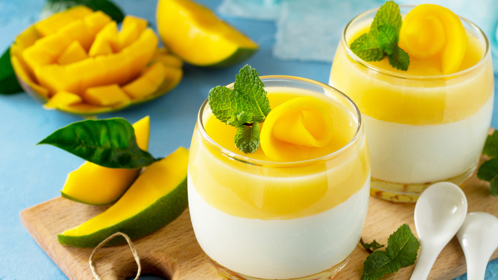 Mango panna cotta served in small glass jars