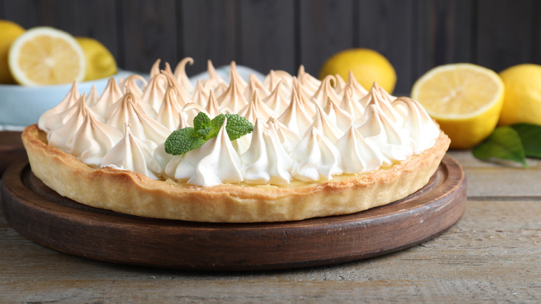 Meringue pie with lemons background