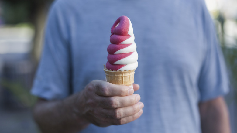 A man holding an ice cream cone 
