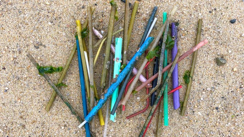 Plastic straws on beach 