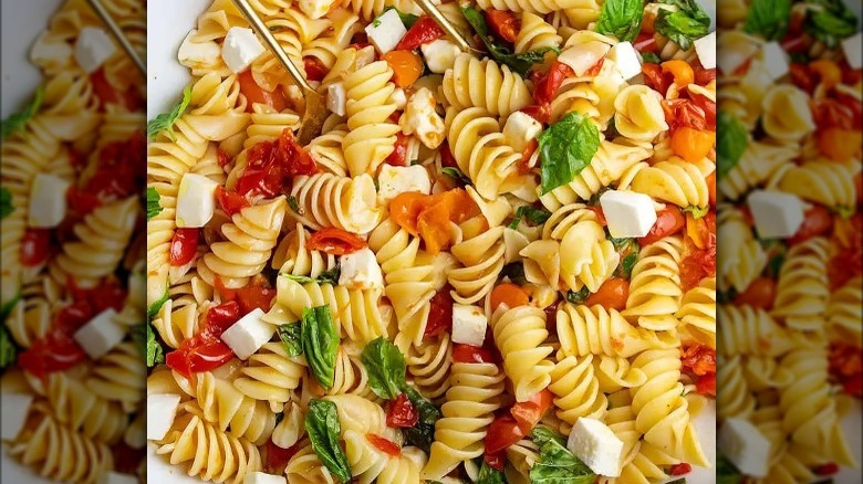 pasta salad with tomatoes, basil, and cheese