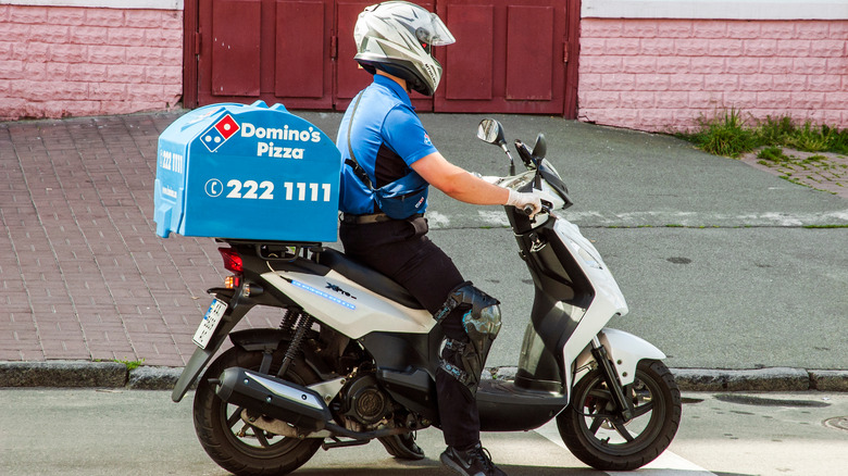 Domino's delivery driver on scooter