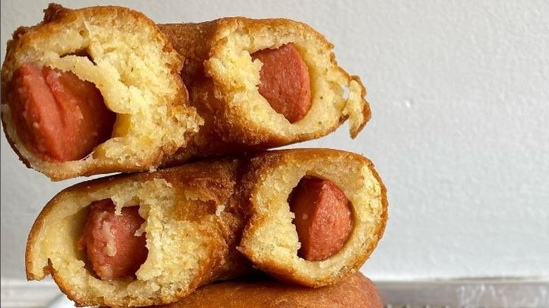 Donut-shaped corn dogs, cut in half