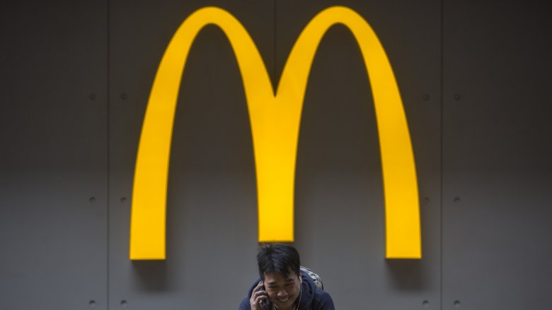 A man in front of McDonalds