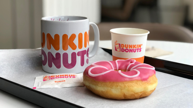 Dunkin donuts coffee cup and pink donut