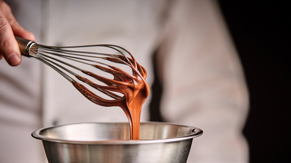 Chef whisking chocolate