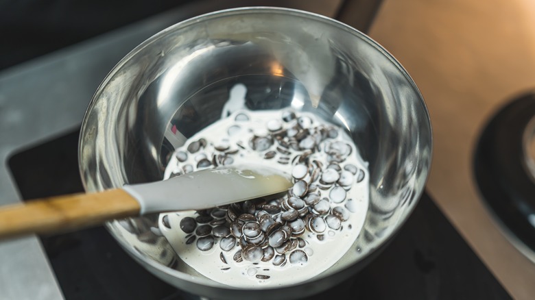 Mixing chocolate with heavy cream