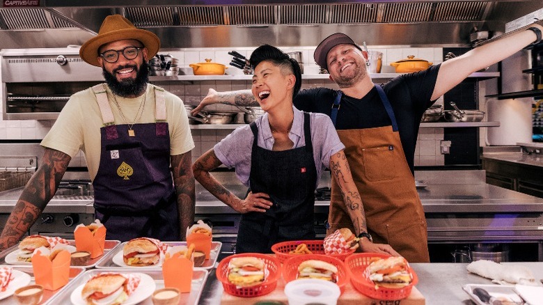 Fast Foodies hosts in kitchen with hamburgers