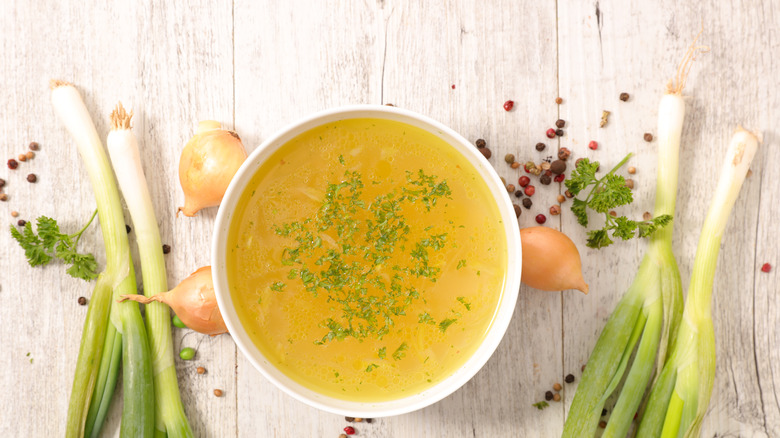 bowl of broth with vegetables