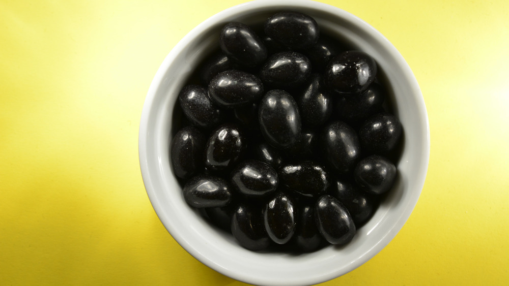 Black jelly beans in bowl