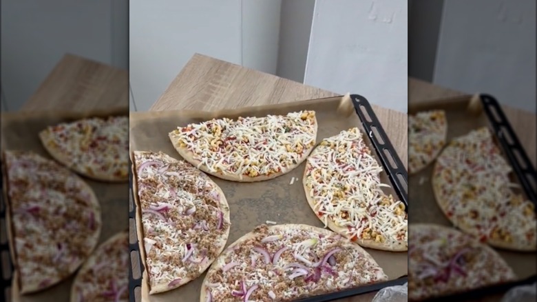 Frozen pizzas cut in half