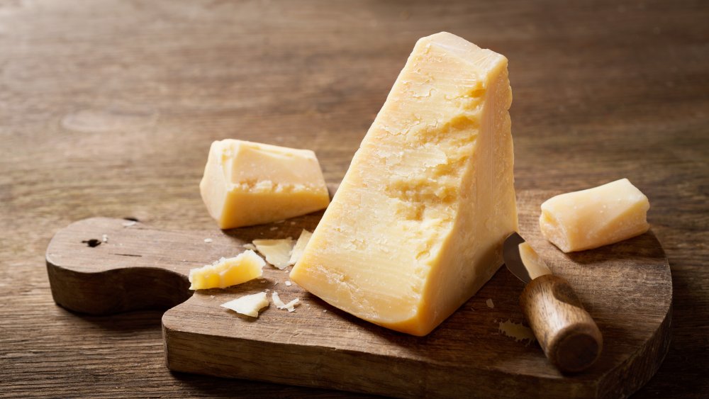 parmesan cheese on a wooden board