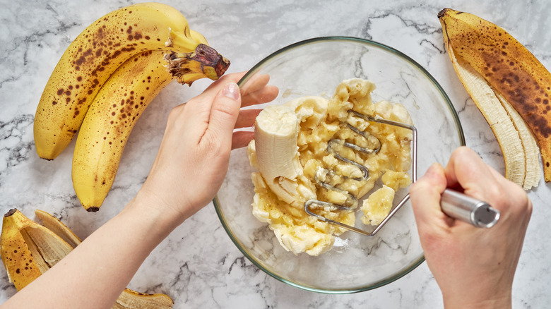 Mashing bananas for banana bread 