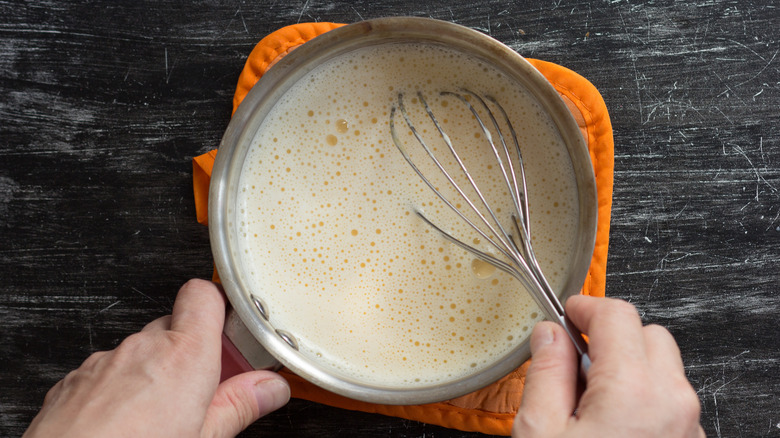 Person whisking a mixture