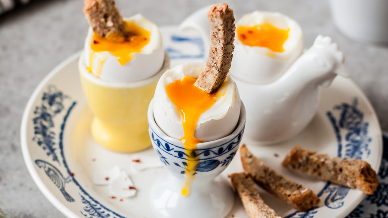 soft boiled eggs in egg cups. 