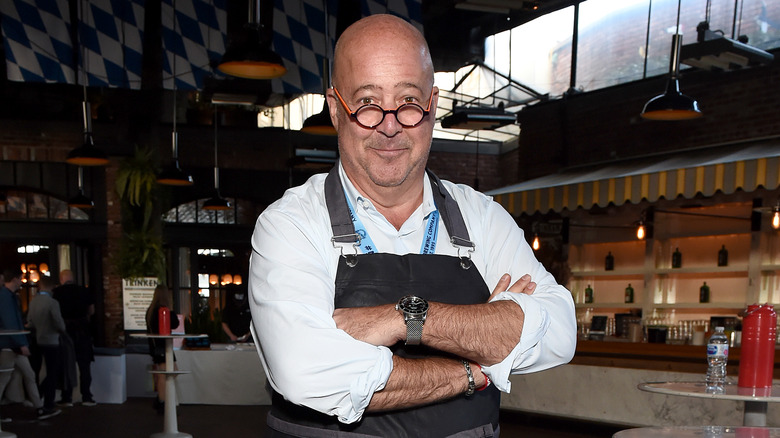 Chef Andrew Zimmern posing in a casual shot