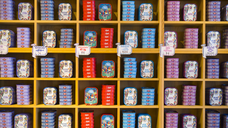 shelves of canned fish in tins