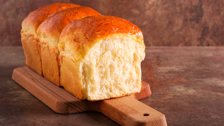 load of Japanese milk bread on cutting board