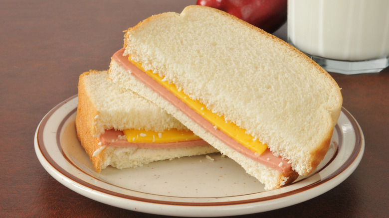 Bologna and cheese sandwich on plate